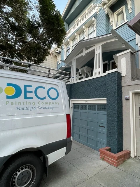 Slate blue painted garage door with white trim on residential home in Novato